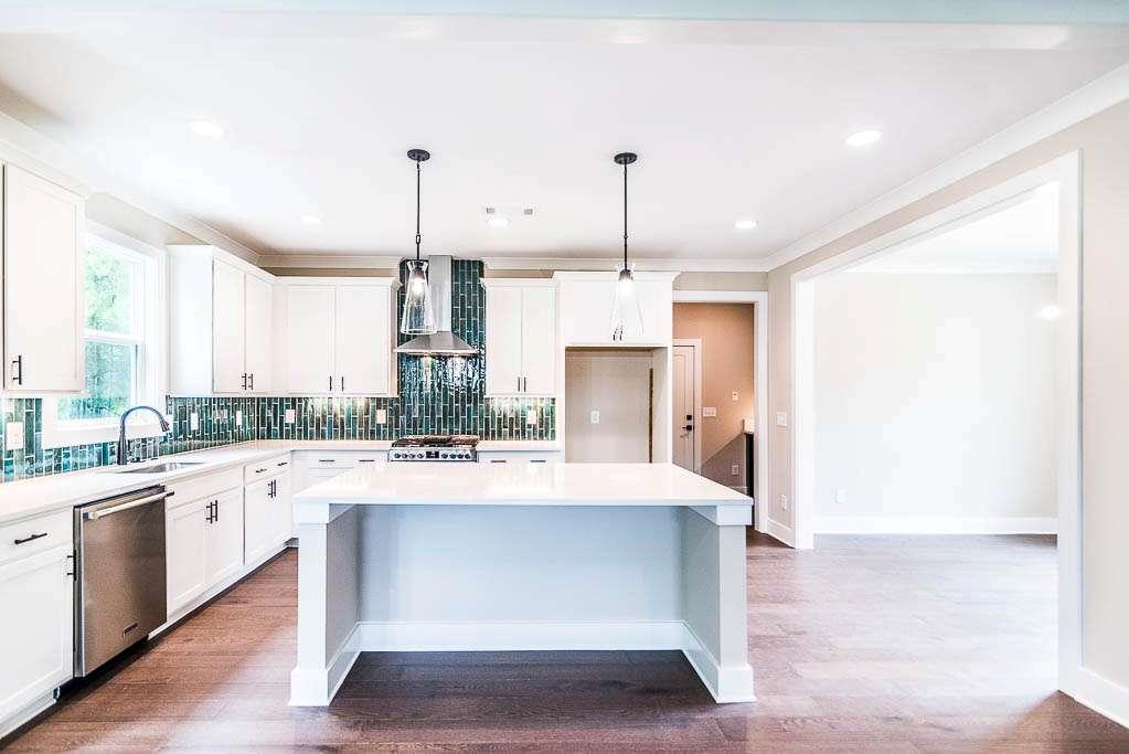2545 Waldrop Ridge Court Decatur, GA 30034 - Photo 3 of 31 a large kitchen with kitchen island a sink stainless steel appliances and cabinets