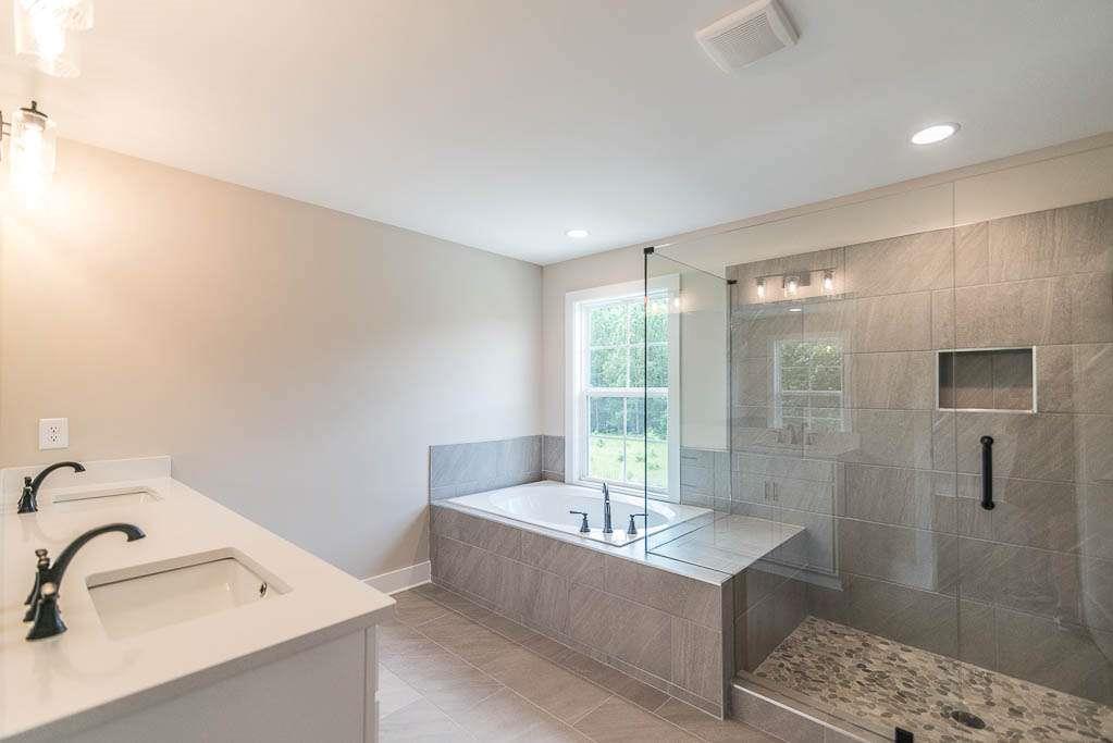 2545 Waldrop Ridge Court Decatur, GA 30034 - Photo 31 of 31 a bathroom with a tub sink and shower