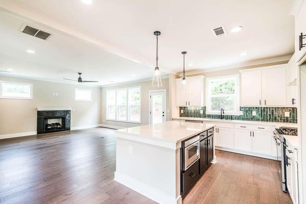 2545 Waldrop Ridge Court Decatur, GA 30034 - Photo 4 of 31 a kitchen with a stove sink and cabinets