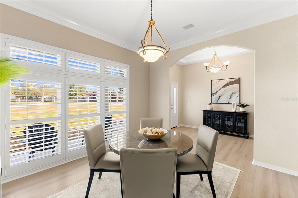 12305 Twin Branch Acres Road Tampa, FL 33626 - Photo 11 of 66 a view of a dining room with furniture window and wooden floor
