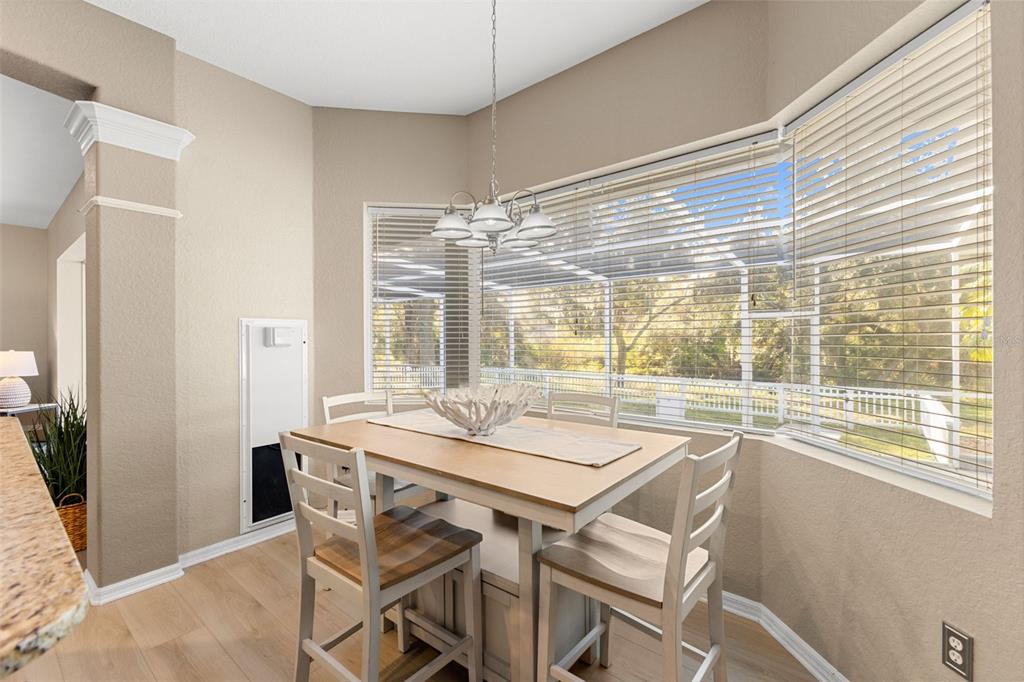 12305 Twin Branch Acres Road Tampa, FL 33626 - Photo 14 of 66 a dining room with a table and chairs