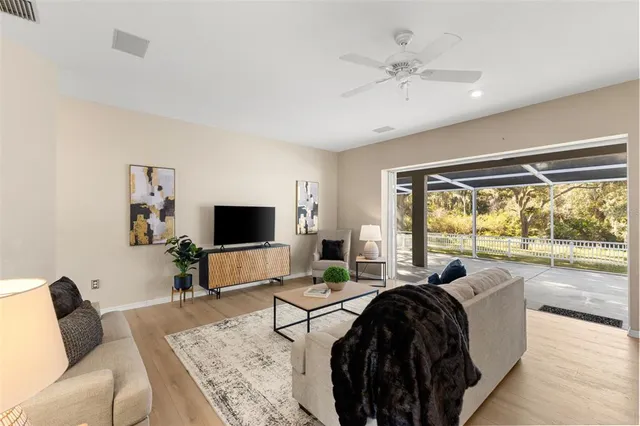 a spacious bathroom with a tub sink and mirror
