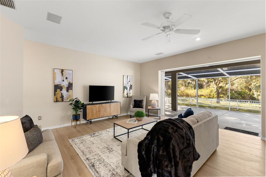 12305 Twin Branch Acres Road Tampa, FL 33626 - Photo 15 of 66 a living room with furniture and a large window