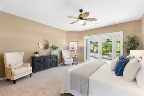 a view of a livingroom with furniture and a flat screen tv