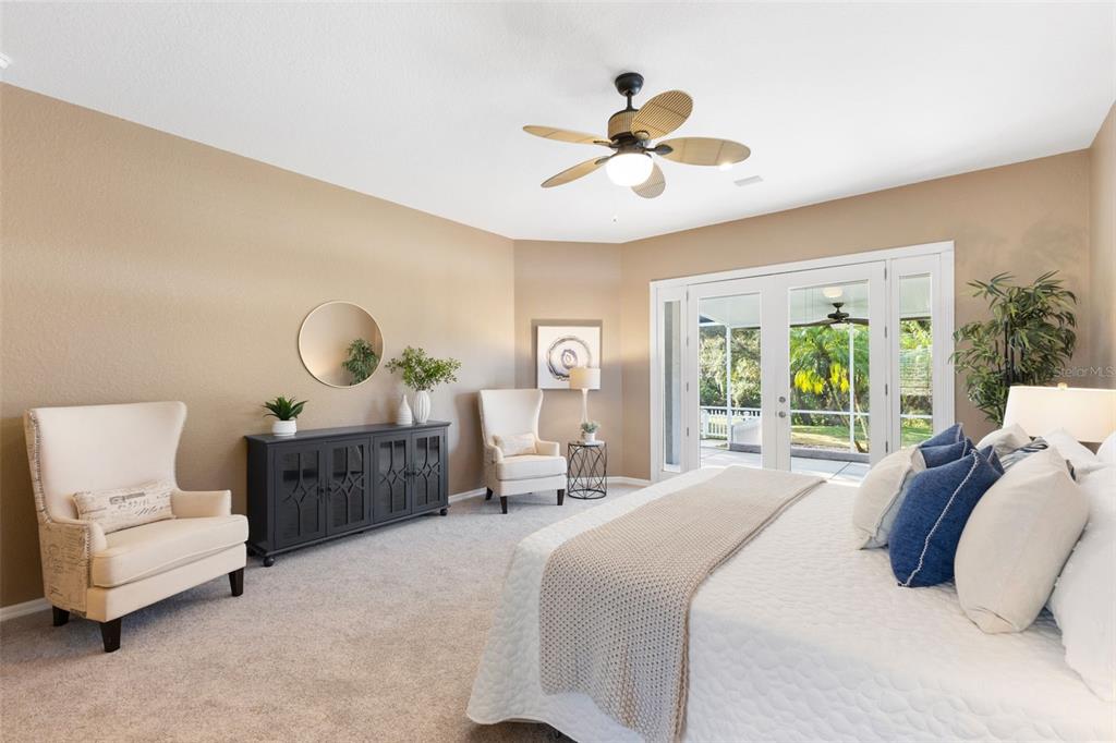 12305 Twin Branch Acres Road Tampa, FL 33626 - Photo 16 of 60 a bedroom with a large bed and a large window