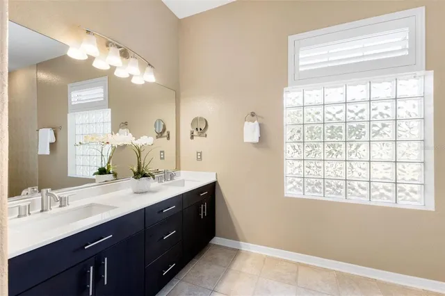 a bathroom with a tub and window
