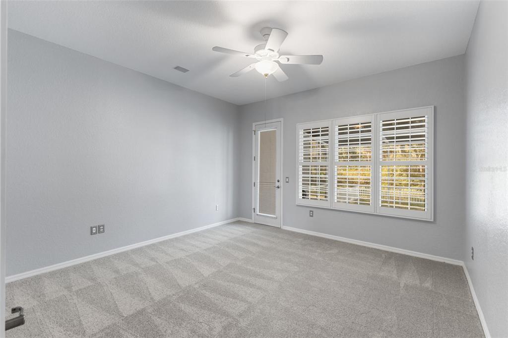 12305 Twin Branch Acres Road Tampa, FL 33626 - Photo 21 of 60 a view of an empty room with a window