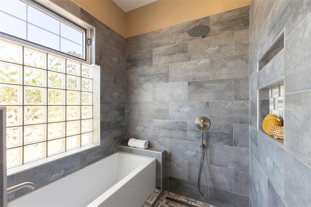12305 Twin Branch Acres Road Tampa, FL 33626 - Photo 23 of 66 a bathroom with a tub and window