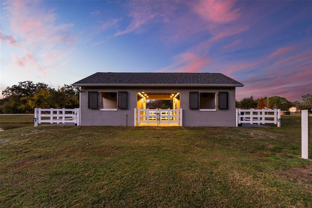 12305 Twin Branch Acres Road Tampa, FL 33626 - Photo 29 of 66 a front view of a house with a yard