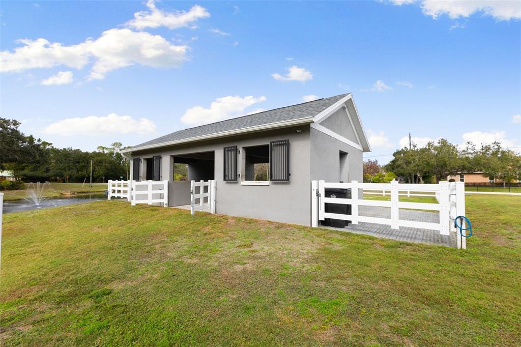 12305 Twin Branch Acres Road Tampa, FL 33626 - Photo 31 of 66 a front view of a house with swimming pool
