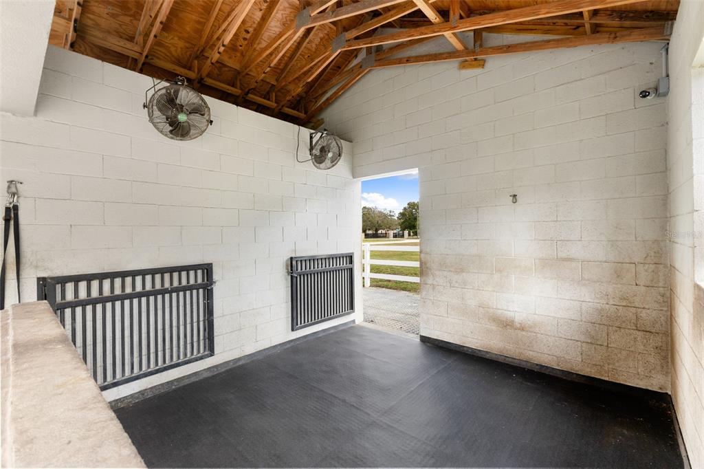 12305 Twin Branch Acres Road Tampa, FL 33626 - Photo 37 of 66 a view of a room with racks on the wall