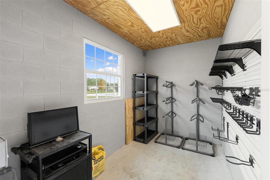 12305 Twin Branch Acres Road Tampa, FL 33626 - Photo 42 of 66 a view of a livingroom with furniture and a flat screen tv