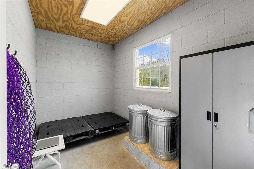 12305 Twin Branch Acres Road Tampa, FL 33626 - Photo 44 of 66 a room with a stove and a refrigerator