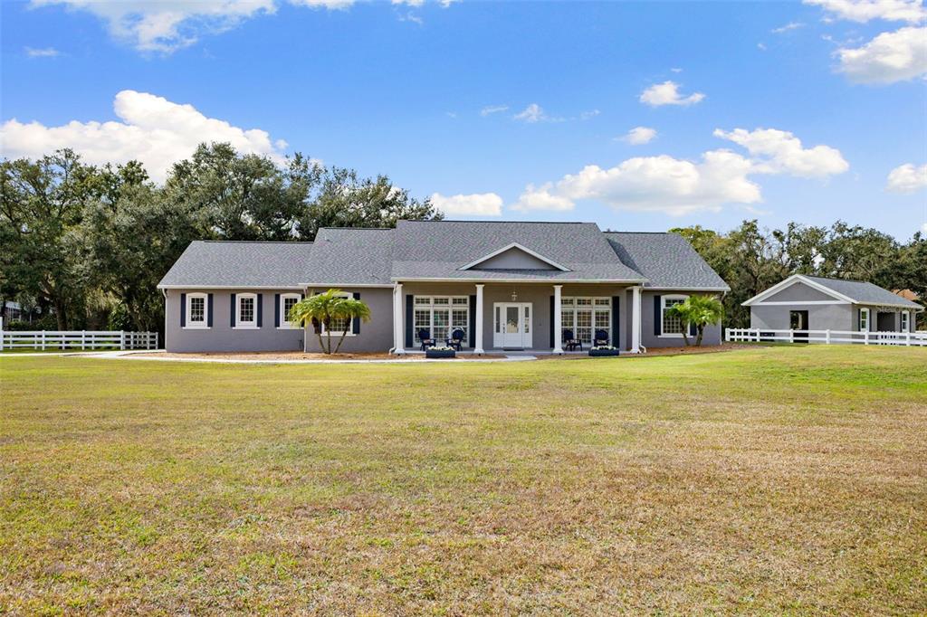 12305 Twin Branch Acres Road Tampa, FL 33626 - Photo 66 of 66 a front view of a house with swimming pool