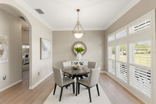 a dining room with a table and chairs