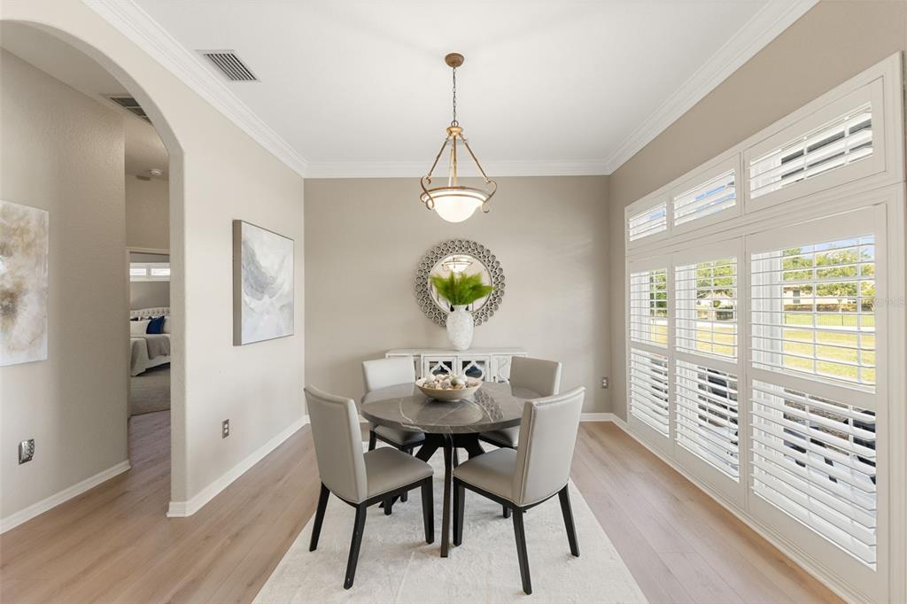12305 Twin Branch Acres Road Tampa, FL 33626 - Photo 10 of 66 a view of a dining room with furniture window and wooden floor