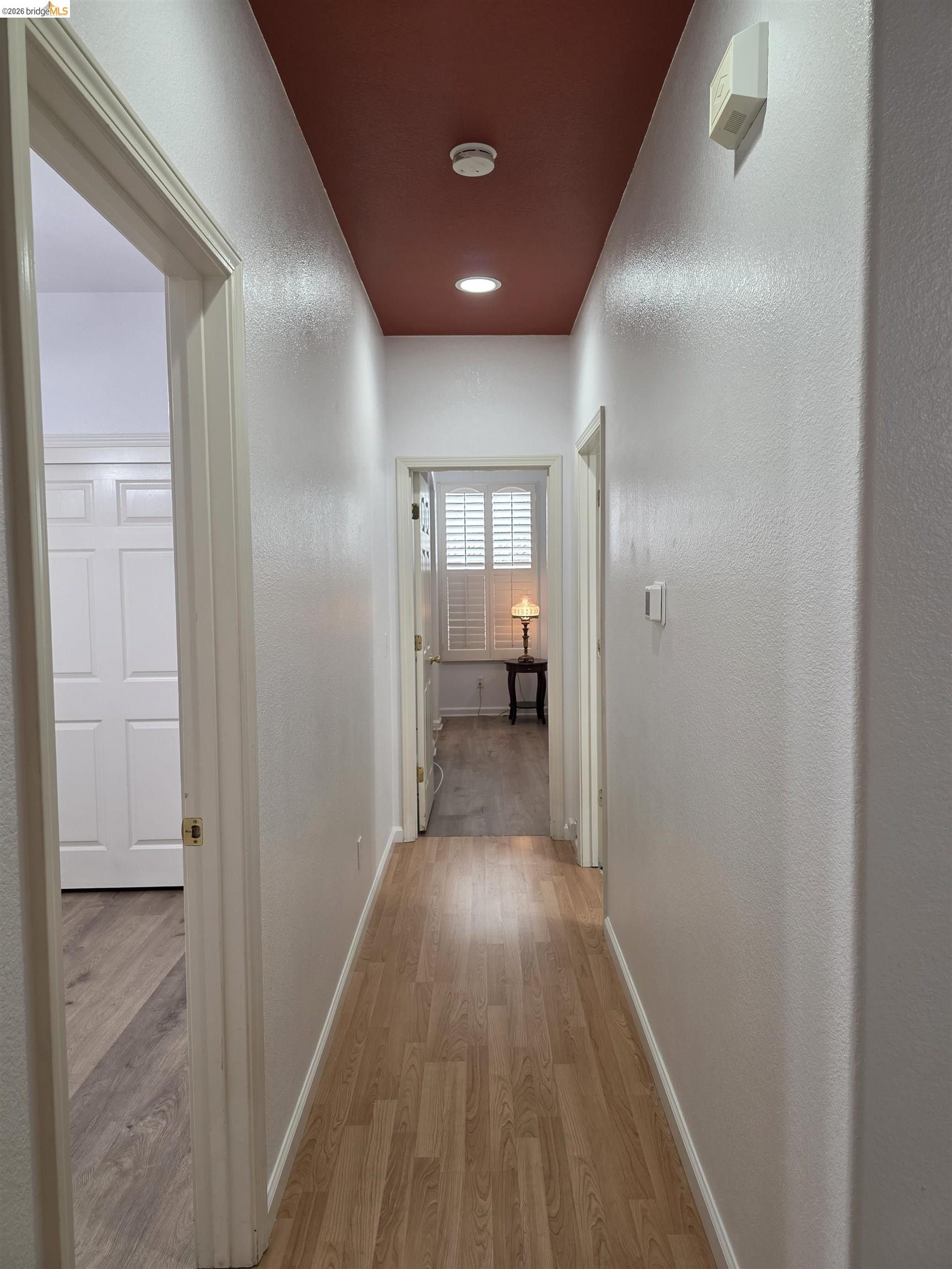 2607 Glow Road Riverbank, CA 95367 - Photo 27 of 42 Hallway featuring wood-finish flooring, recessed lighting, and a painted ceiling