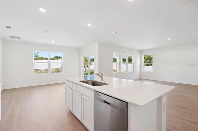a kitchen with sink and window