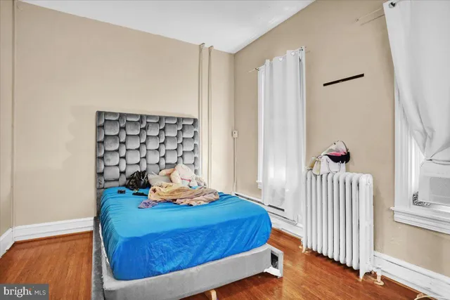 a bed room with a bed and a window