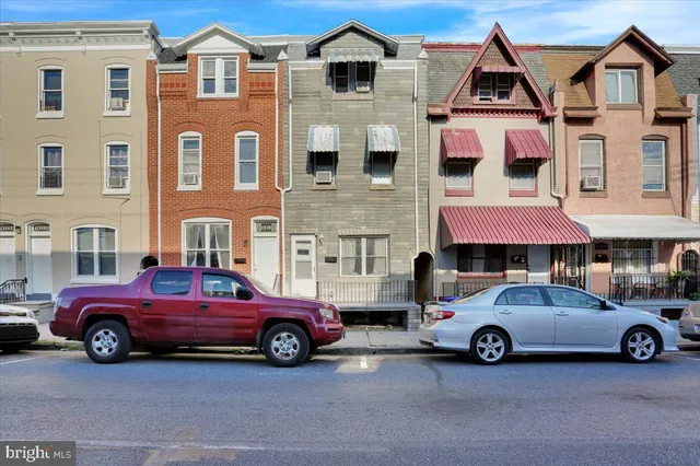 a car parked in front of a house