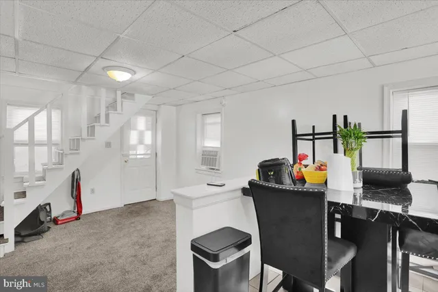 a kitchen with a refrigerator and a sink