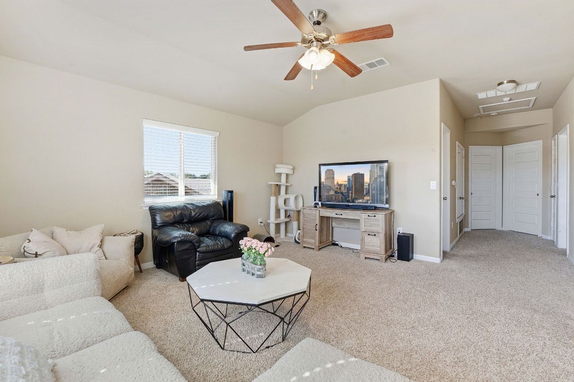 608 Palo Duro Loop Round Rock, TX 78664 - Photo 14 of 28 a living room with furniture and a flat screen tv