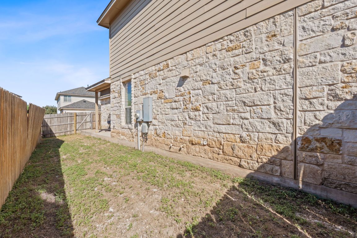 608 Palo Duro Loop Round Rock, TX 78664 - Photo 27 of 28 a view of a yard with brick wall