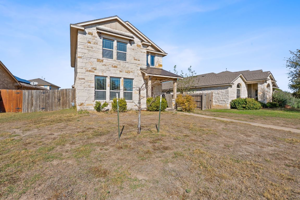 608 Palo Duro Loop Round Rock, TX 78664 - Photo 3 of 28 a front view of a house with a yard and garage