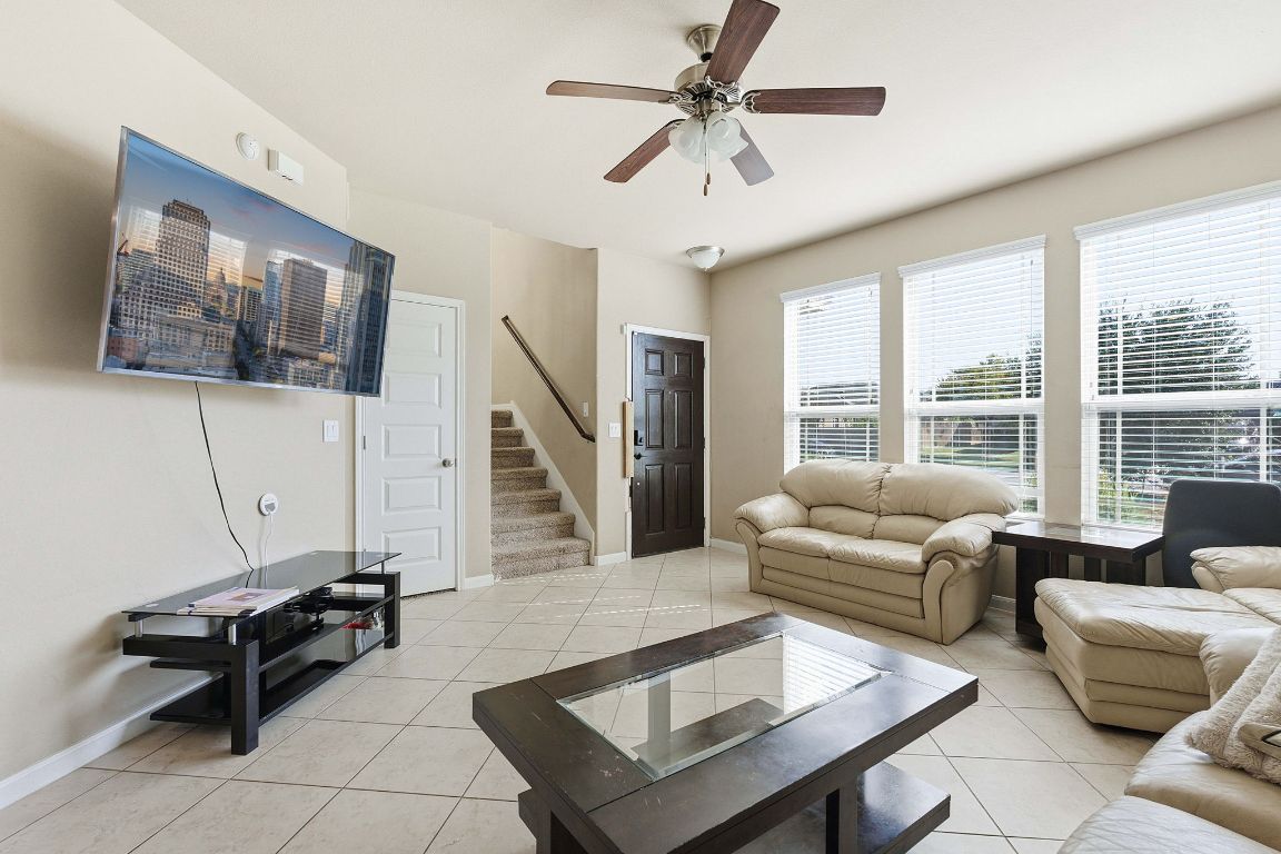 608 Palo Duro Loop Round Rock, TX 78664 - Photo 9 of 28 a living room with furniture and a flat screen tv