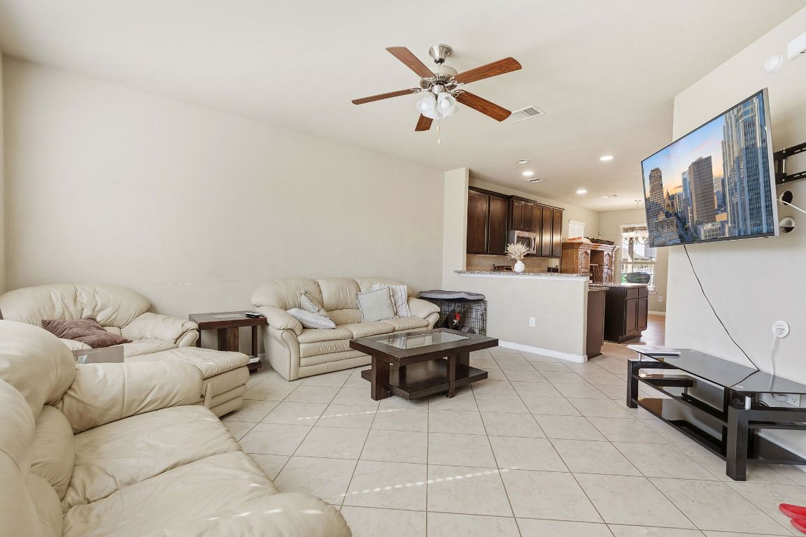 608 Palo Duro Loop Round Rock, TX 78664 - Photo 10 of 28 a living room with furniture and kitchen view