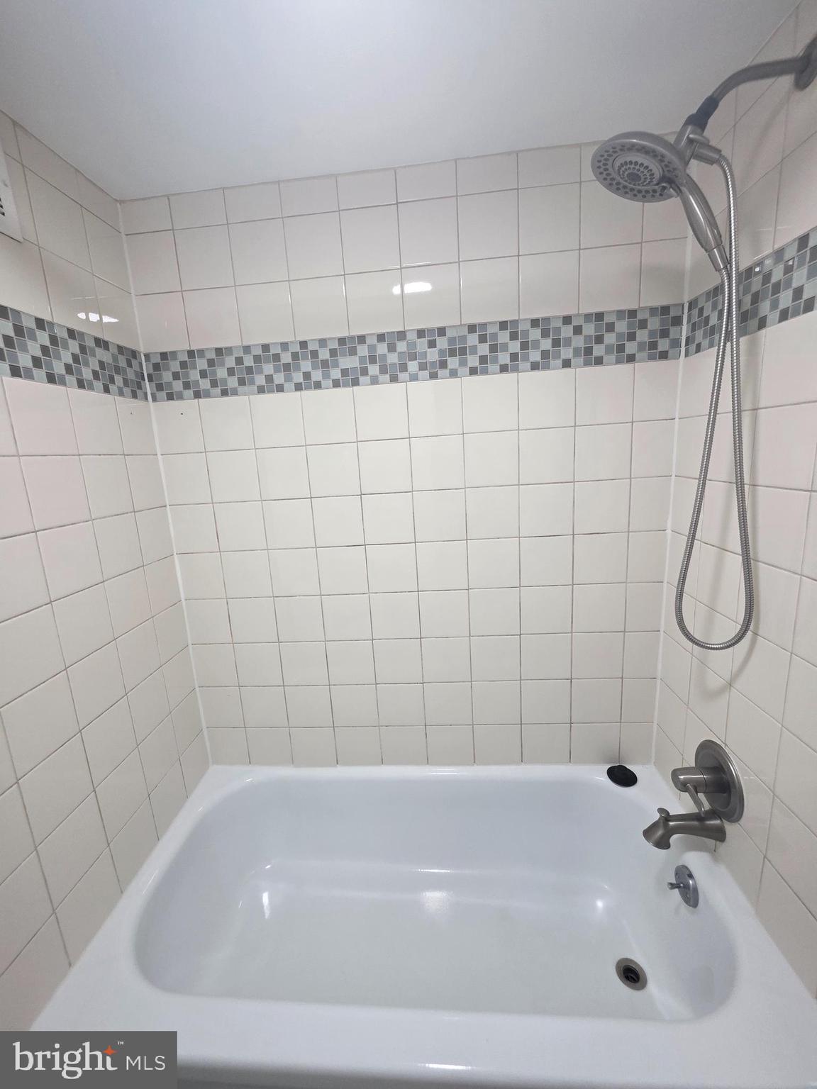 1836 Metzerott Road, Unit 1704 Adelphi, MD 20783 - Photo 43 of 47 a bathroom with a bath tub and shower