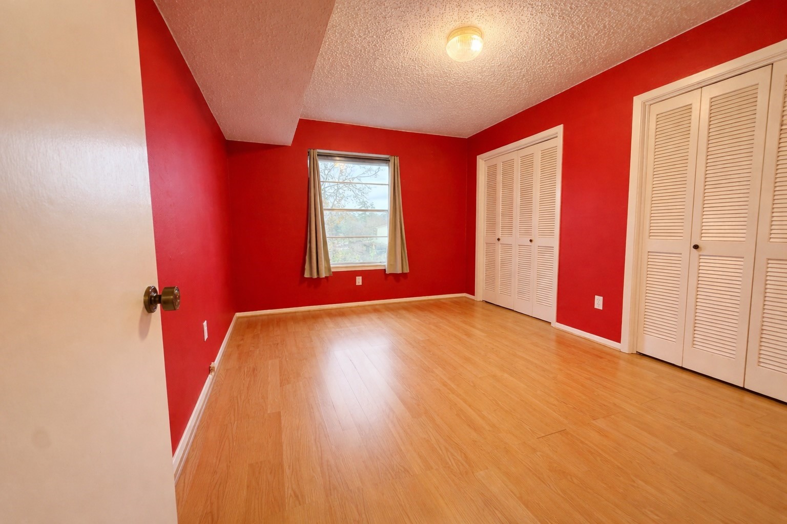 8223 Kingsbrook Road, Unit 215 Houston, TX 77024 - Photo 14 of 20 Secondary bedroom with window and two closets for ample storage.