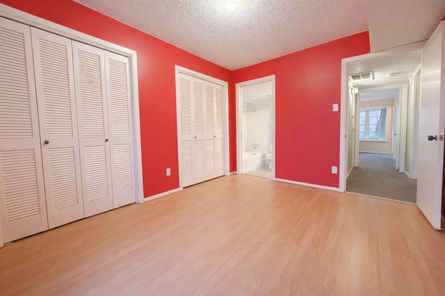 8223 Kingsbrook Road, Unit 215 Houston, TX 77024 - Photo 15 of 20 Another angle showcasing the secondary bedroom, emphasizing the private bathroom access.