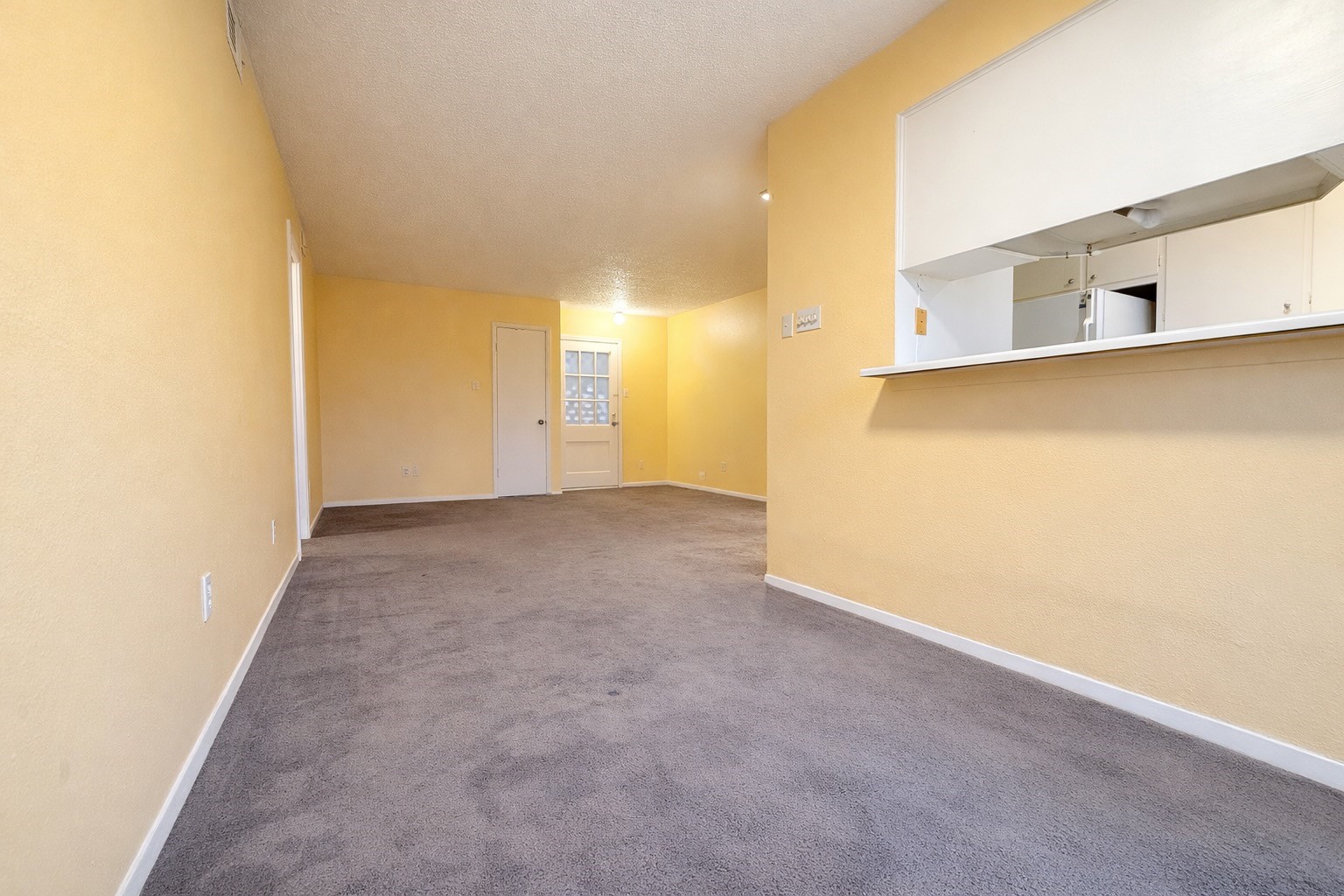 8223 Kingsbrook Road, Unit 215 Houston, TX 77024 - Photo 7 of 20 View from the dining space looking towards the living space. The kitchen is on the right in the photo.