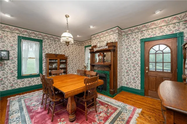 a view of a dining room with furniture and window