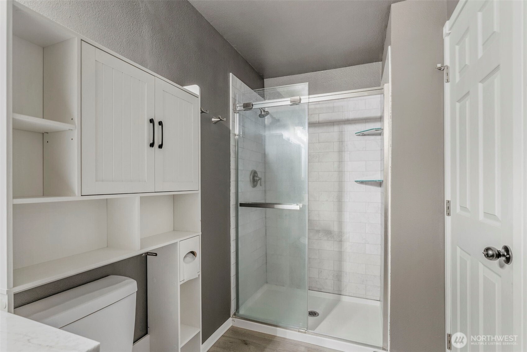 202 Waters Road Castle Rock, WA 98611 - Photo 36 of 38 a bathroom with a glass shower door