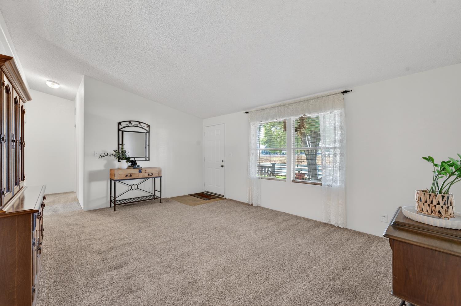 2450 George Road Williams, CA 95987 - Photo 11 of 43 a living room with furniture and window
