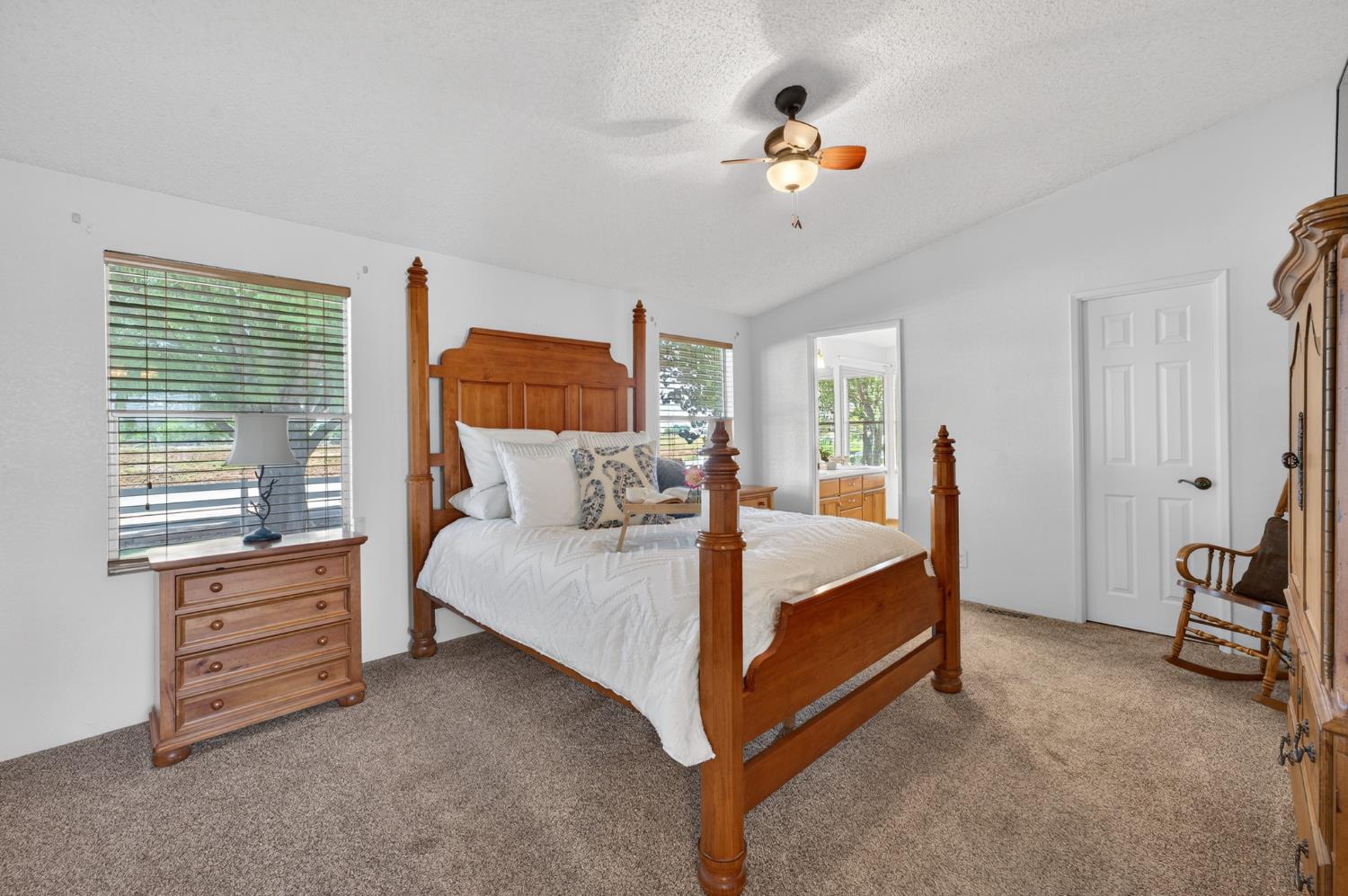 2450 George Road Williams, CA 95987 - Photo 13 of 43 a bed room with a bed and a chandelier