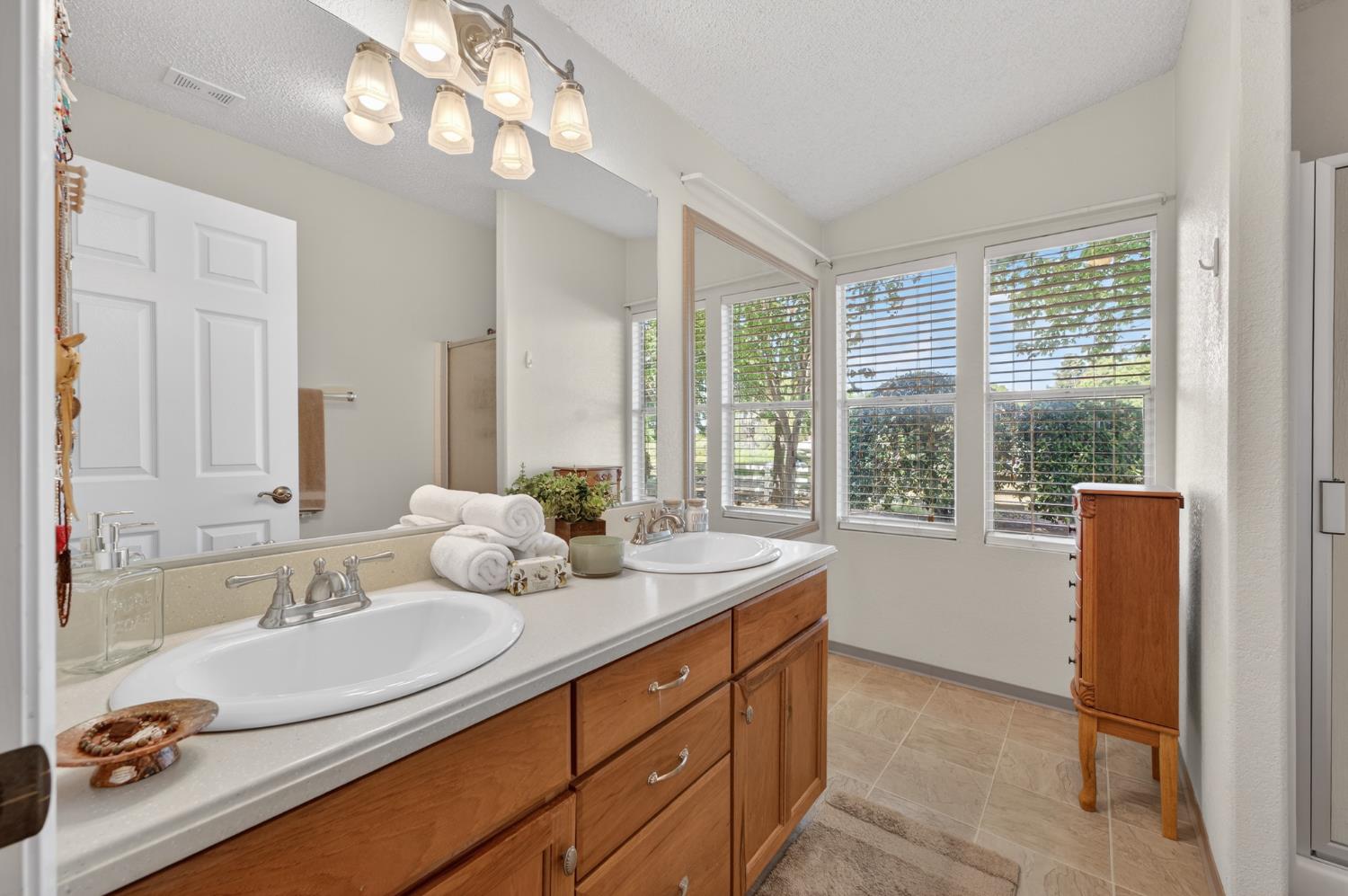 2450 George Road Williams, CA 95987 - Photo 15 of 43 a bathroom with a granite countertop sink and a large mirror