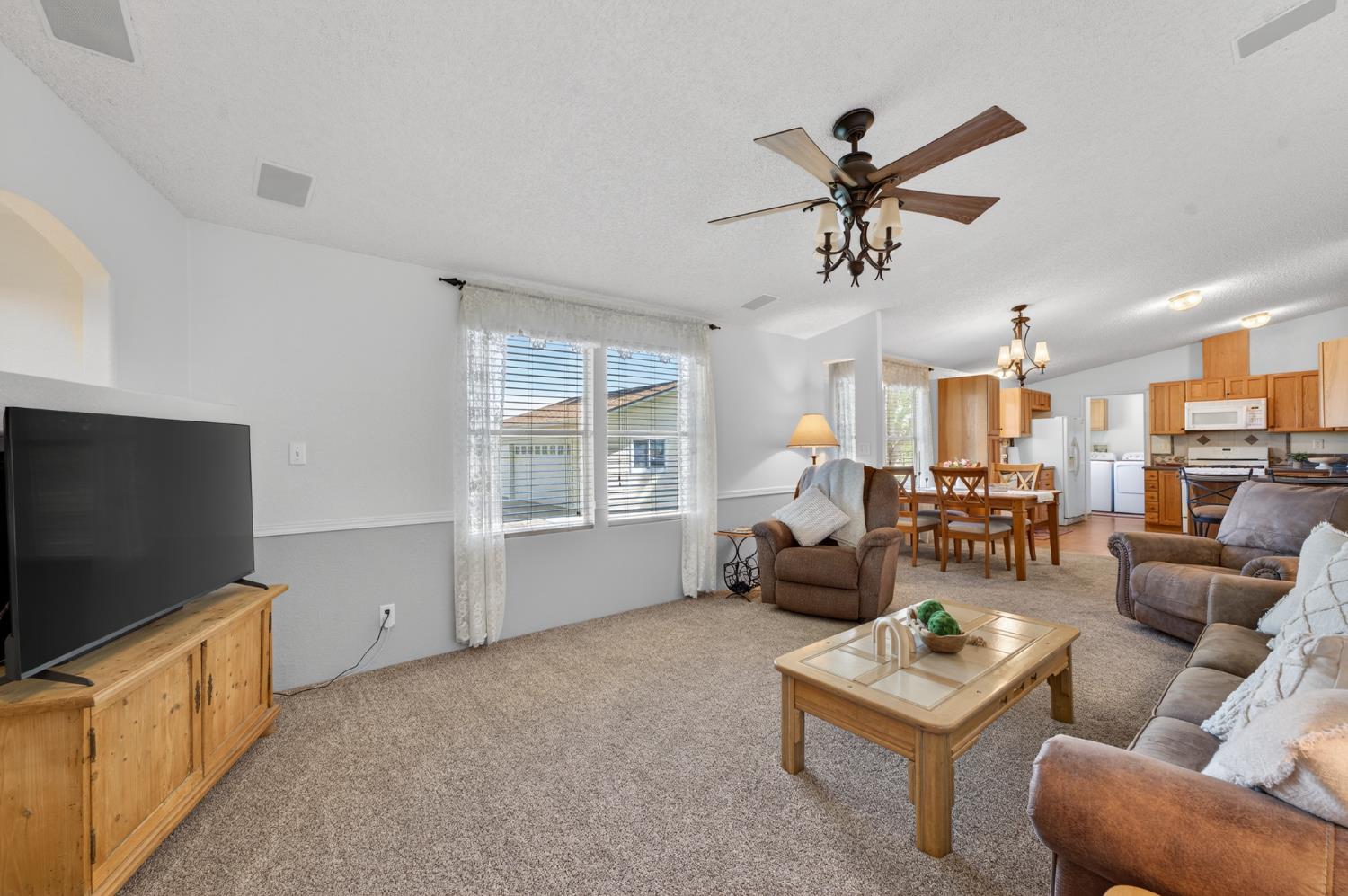2450 George Road Williams, CA 95987 - Photo 20 of 43 a living room with furniture and a flat screen tv