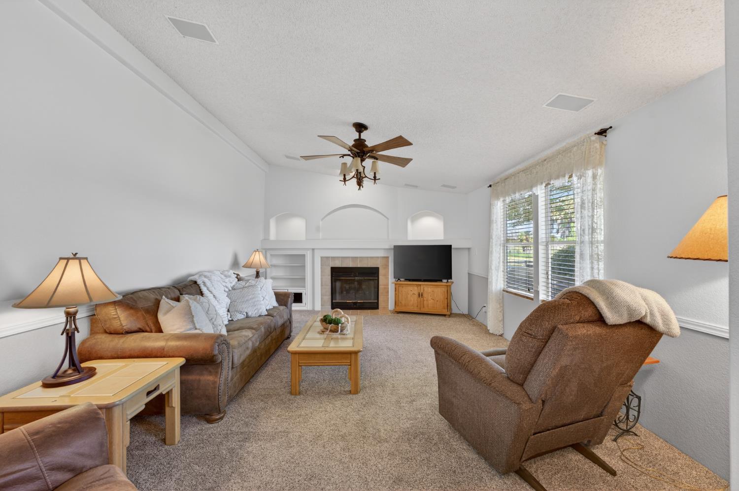 2450 George Road Williams, CA 95987 - Photo 21 of 43 a living room with furniture fireplace and window