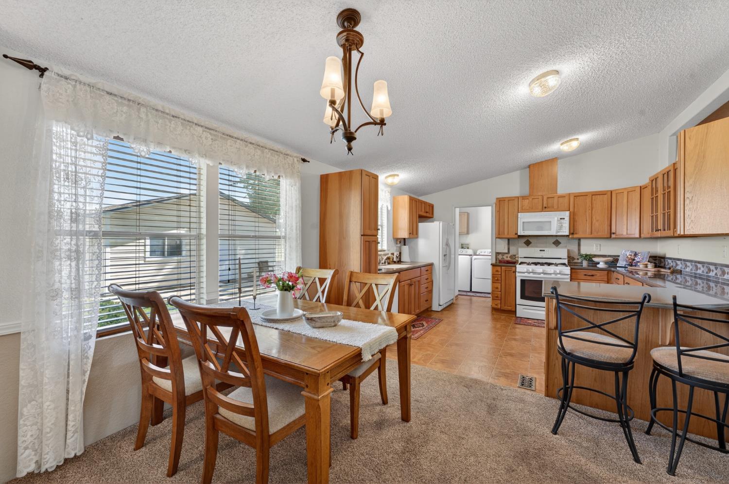 2450 George Road Williams, CA 95987 - Photo 22 of 43 a view of a dining room with furniture window and outside view