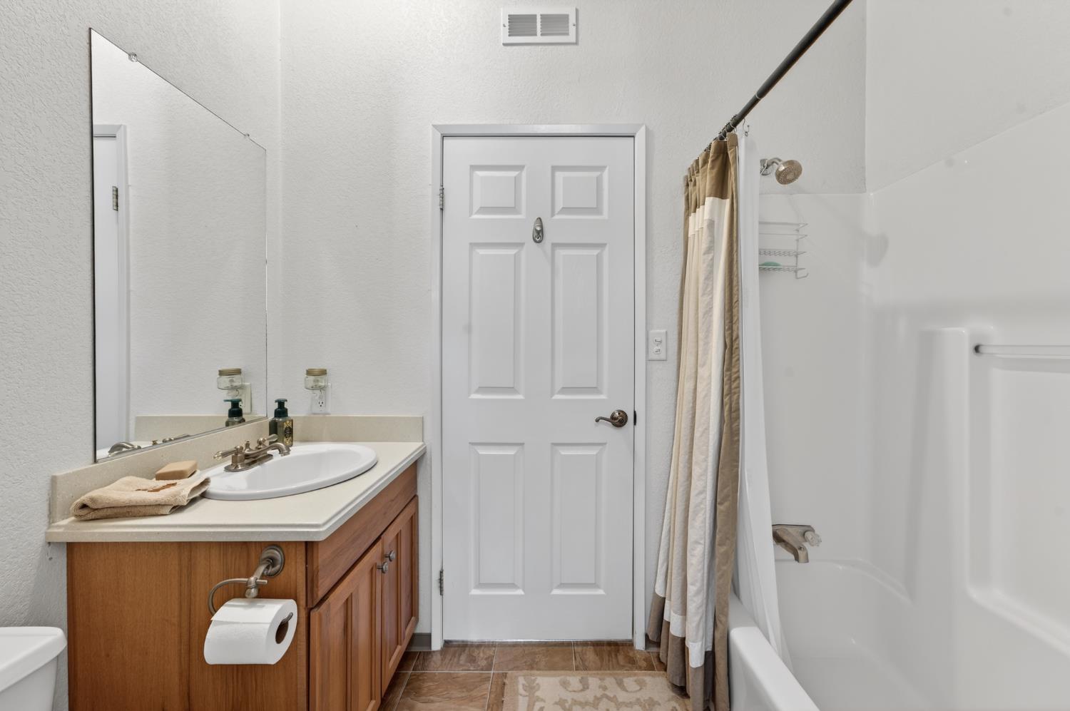 2450 George Road Williams, CA 95987 - Photo 28 of 43 a bathroom with a sink a mirror and a shower