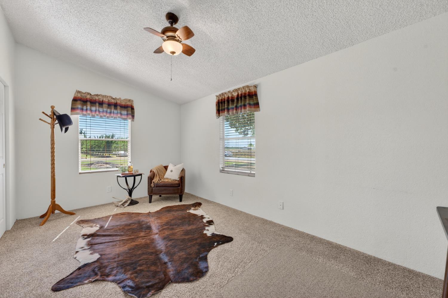 2450 George Road Williams, CA 95987 - Photo 30 of 43 a bedroom with a bed and wooden floor