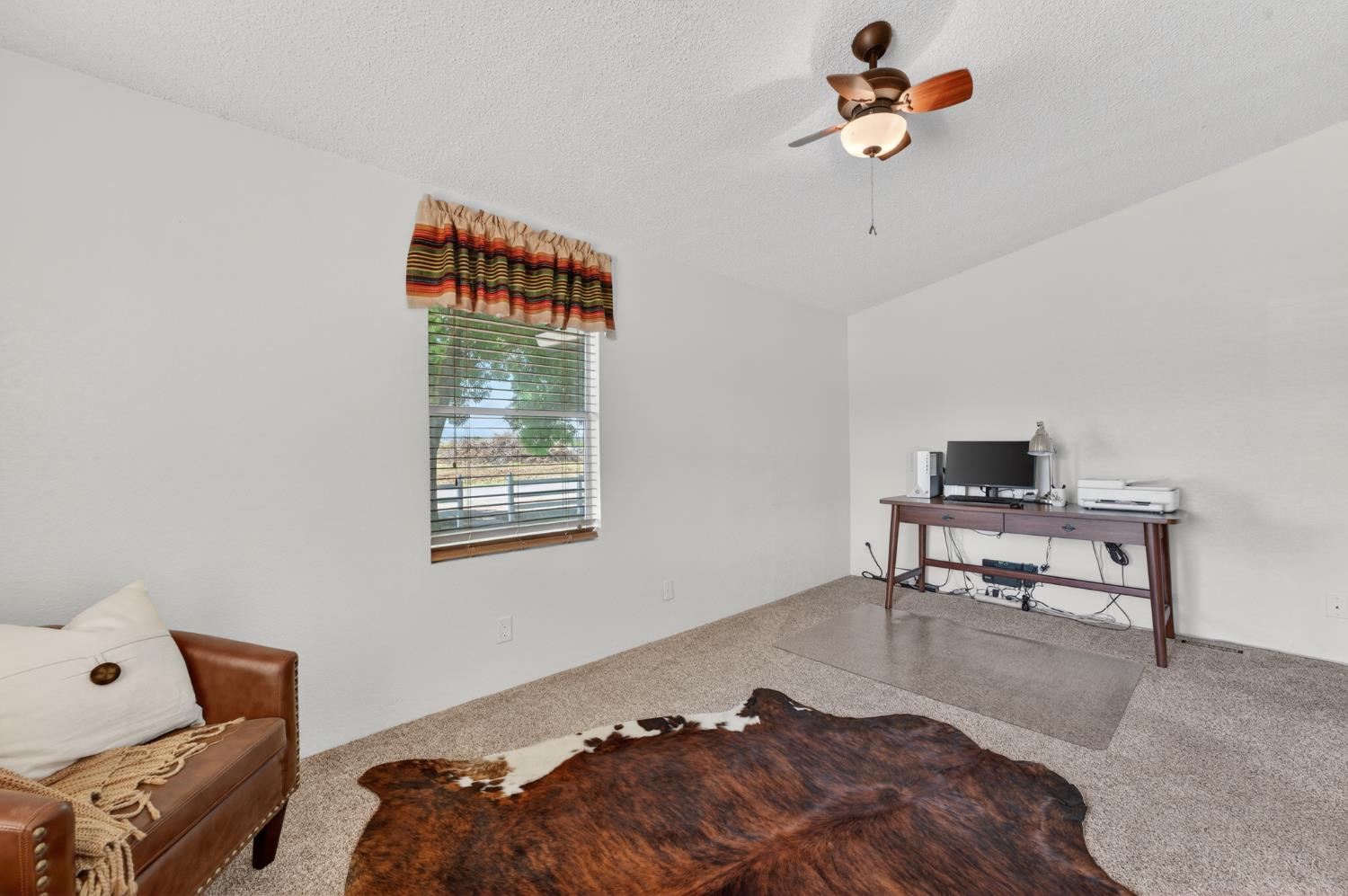 2450 George Road Williams, CA 95987 - Photo 31 of 43 a living room with furniture and a window