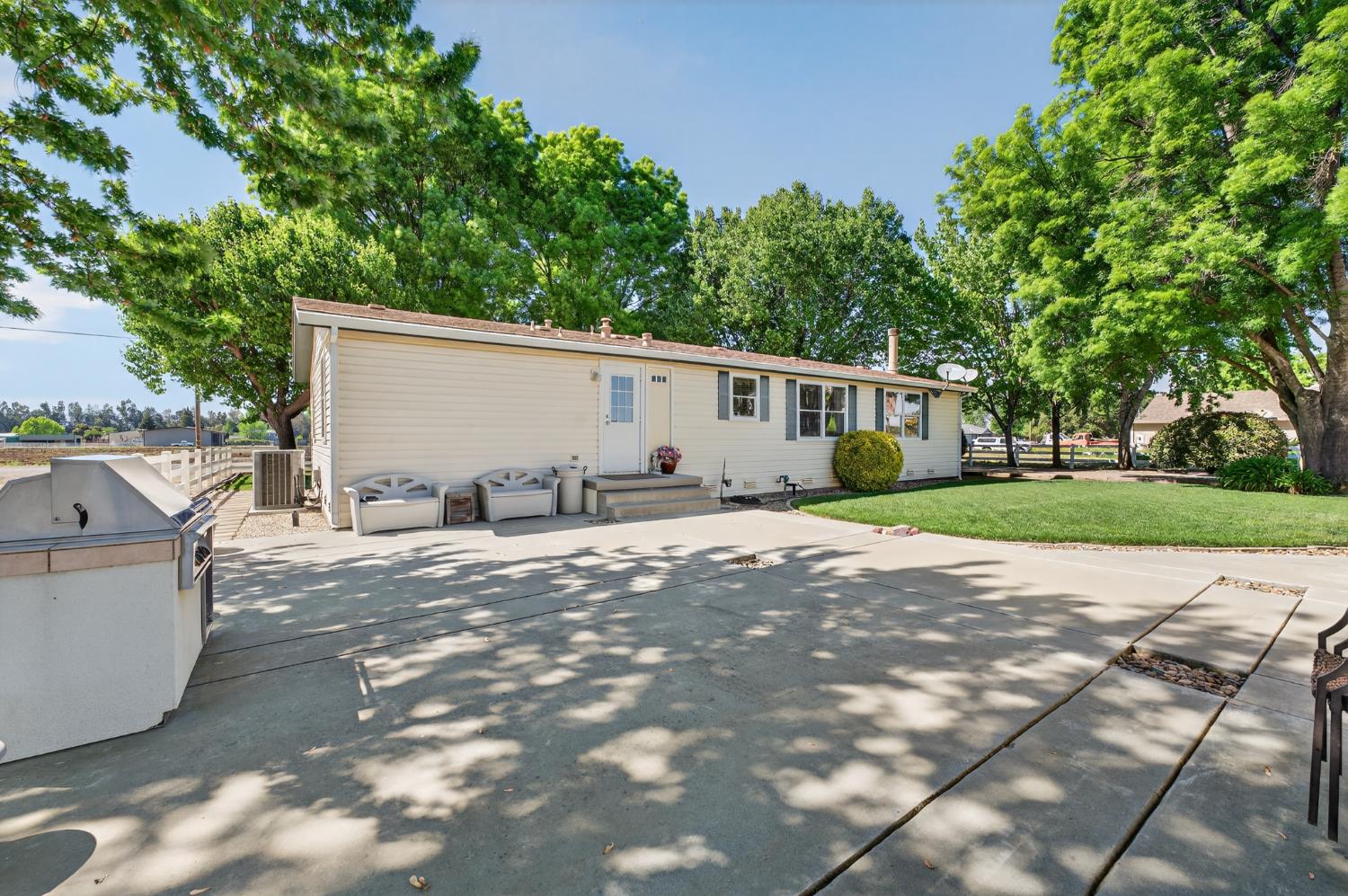 2450 George Road Williams, CA 95987 - Photo 34 of 43 a view of a house with backyard and trees