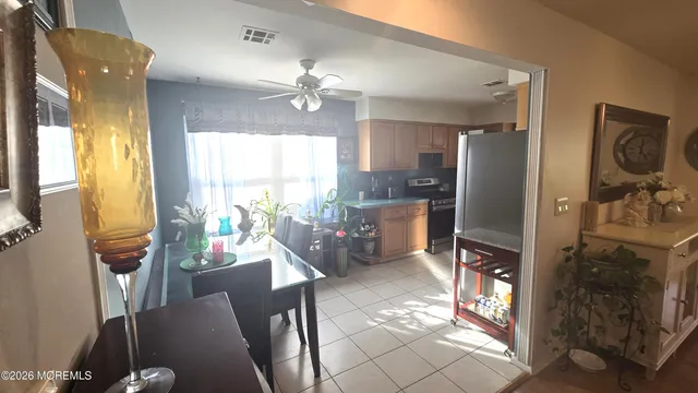 a view of a dining room with furniture window and outside view