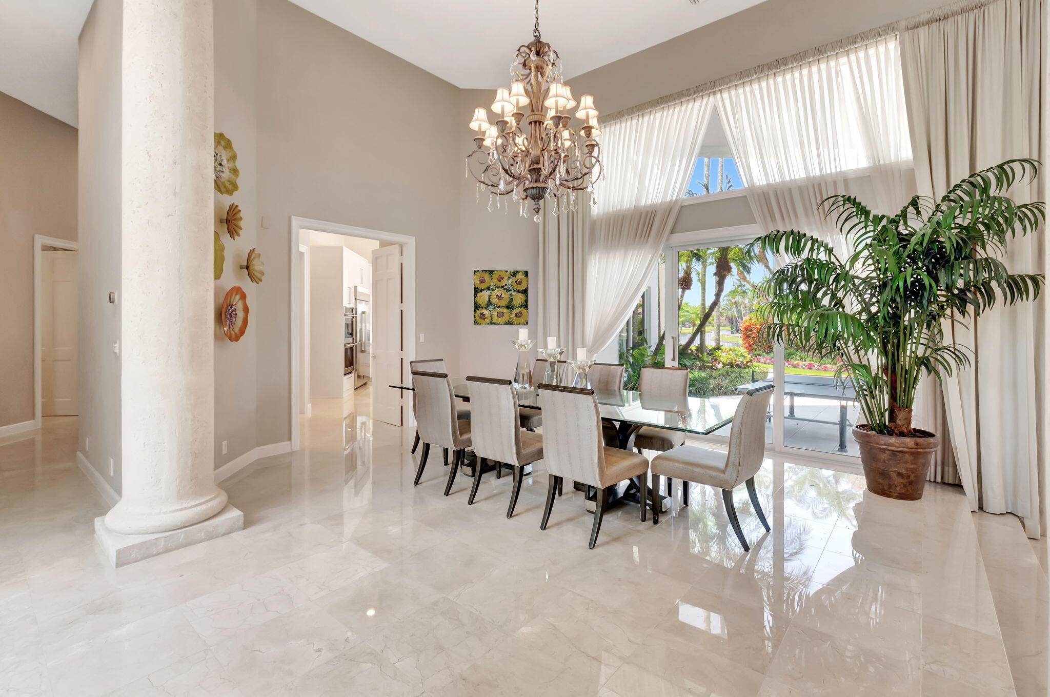 2599 Northwest 63rd Lane Boca Raton, FL 33496 - Photo 12 of 81 a view of a dining room with furniture and a chandelier