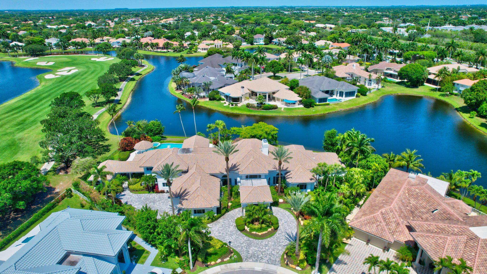 2599 Northwest 63rd Lane Boca Raton, FL 33496 - Photo 2 of 81 an aerial view of a house with a swimming pool yard and outdoor seating