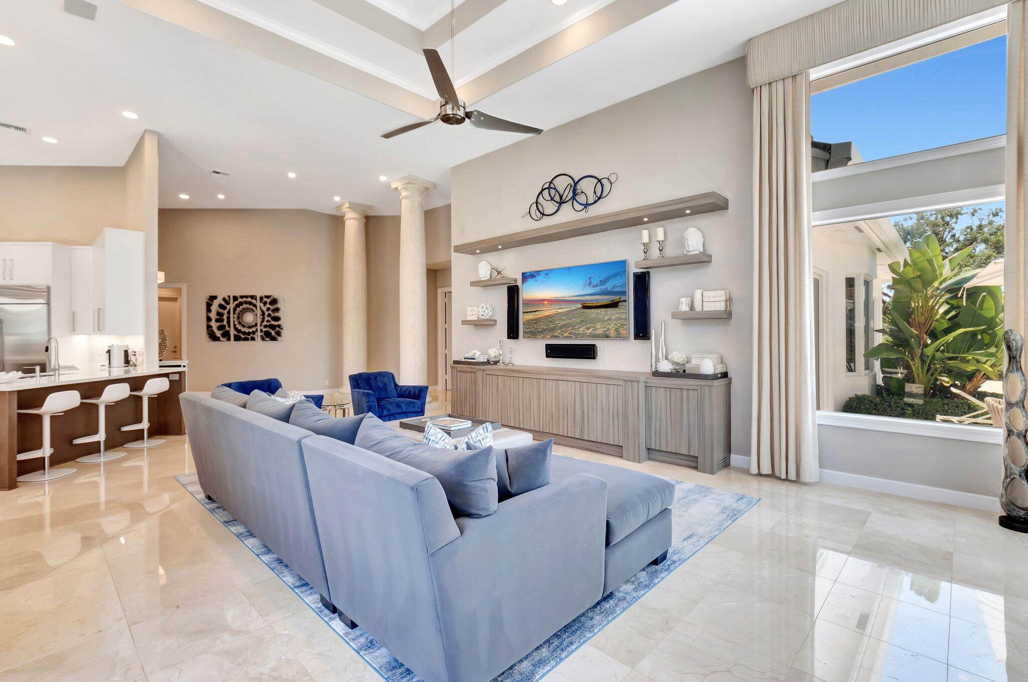 2599 Northwest 63rd Lane Boca Raton, FL 33496 - Photo 22 of 81 a living room with furniture and a flat screen tv